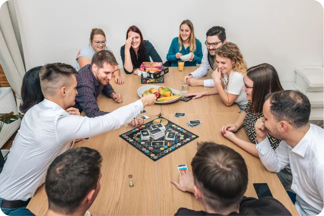 DecisionRules team gathering around a table